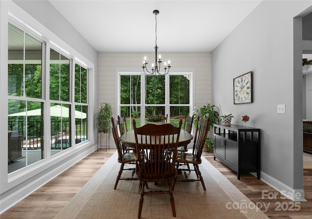 2646 Lee Lawing Rd, Lincolnton, NC 28092 - dining area with a chandelier, healthy amount of natural light, wood finished floors, and baseboards