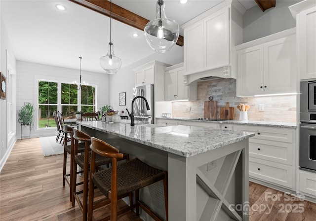 2646 Lee Lawing Rd, Lincolnton, NC 28092 - kitchen featuring appliances with stainless steel finishes, a sink, decorative backsplash, white cabinets, and recessed lighting