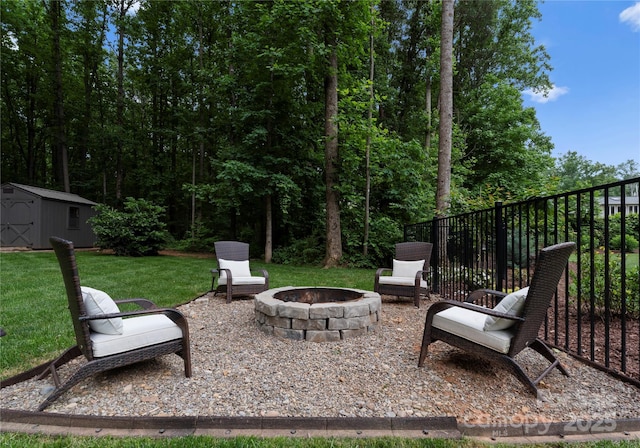 2646 Lee Lawing Rd, Lincolnton, NC 28092 - view of patio featuring a fire pit, a shed, and an outdoor structure