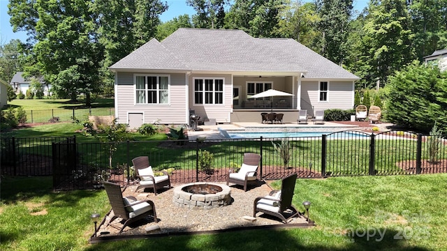 2646 Lee Lawing Rd, Lincolnton, NC 28092 - back of property featuring a fire pit, a patio area, and a shingled roof