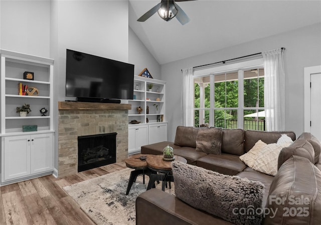 2646 Lee Lawing Rd, Lincolnton, NC 28092 - living room with light wood-type flooring, ceiling fan, a brick fireplace, and high vaulted ceiling