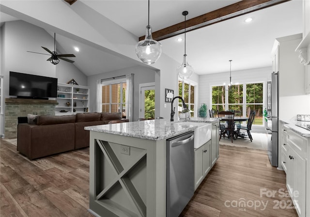 2646 Lee Lawing Rd, Lincolnton, NC 28092 - kitchen with appliances with stainless steel finishes, a sink, ceiling fan, white cabinets, and light stone counters