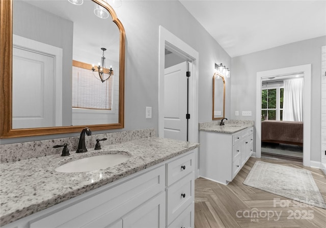 2646 Lee Lawing Rd, Lincolnton, NC 28092 - full bath featuring a chandelier, two vanities, and baseboards
