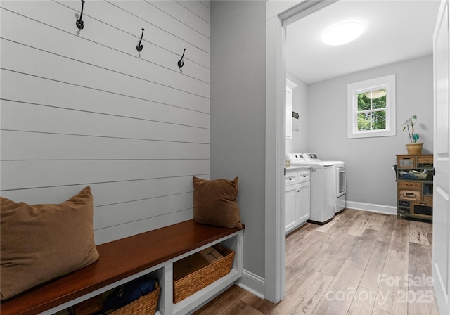 2646 Lee Lawing Rd, Lincolnton, NC 28092 - mudroom with light wood-style flooring, baseboards, and washing machine and clothes dryer