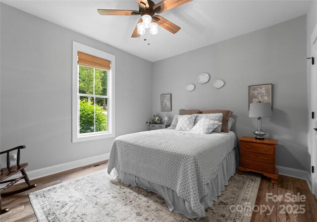 2646 Lee Lawing Rd, Lincolnton, NC 28092 - bedroom featuring baseboards, wood finished floors, and a ceiling fan