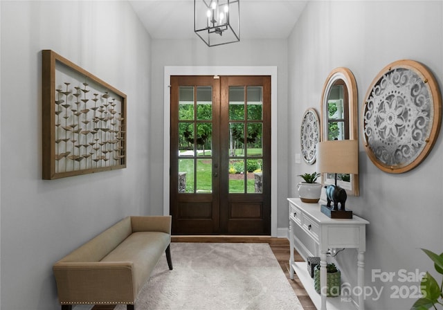 2646 Lee Lawing Rd, Lincolnton, NC 28092 - foyer with wood finished floors, a chandelier, french doors, and baseboards