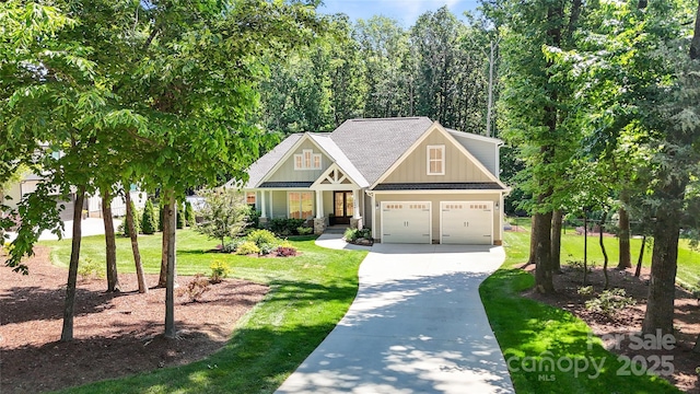 2646 Lee Lawing Rd, Lincolnton, NC 28092 - craftsman house with board and batten siding, driveway, a front yard, a shingled roof, and a garage