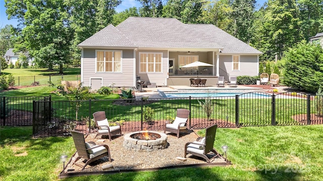 2646 Lee Lawing Rd, Lincolnton, NC 28092 - back of house featuring an outdoor fire pit, a patio, roof with shingles, and a ceiling fan