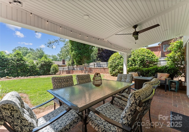 view of patio / terrace featuring outdoor dining space and ceiling fan