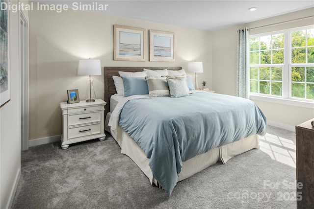bedroom with carpet floors and baseboards