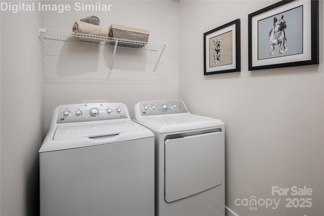 laundry area with laundry area and washer and dryer