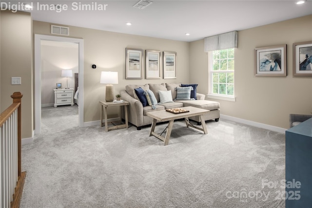 carpeted living area featuring visible vents, recessed lighting, and baseboards