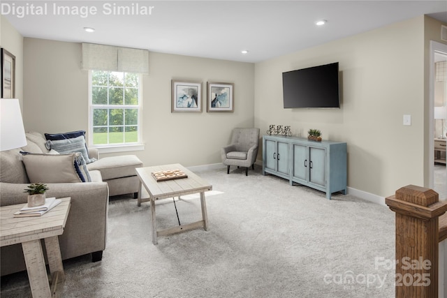 living area featuring baseboards, carpet flooring, and recessed lighting