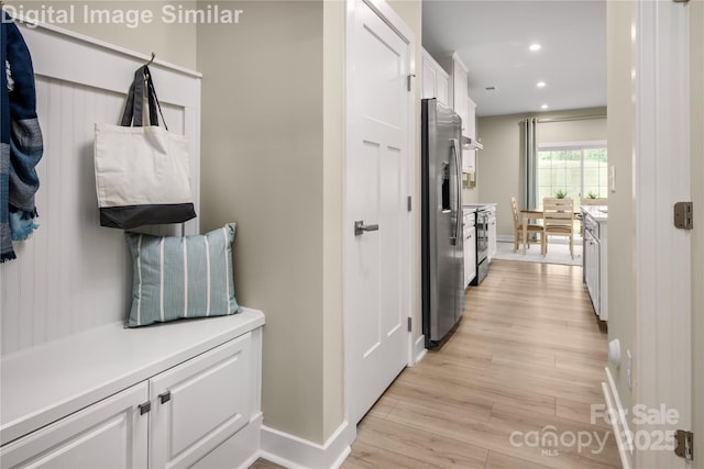 mudroom with baseboards, recessed lighting, and light wood-style flooring