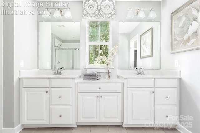 bathroom featuring vanity, baseboards, a stall shower, and visible vents