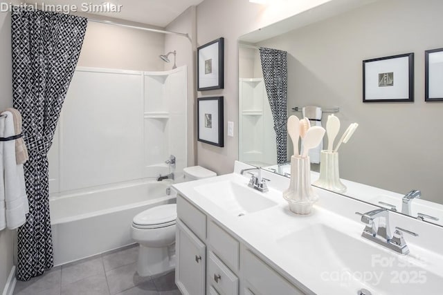 full bathroom featuring a sink, tile patterned floors, toilet, and shower / tub combo