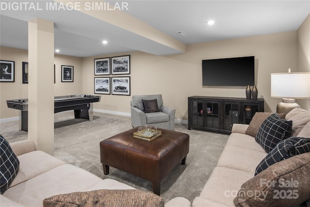living area with baseboards, carpet, and recessed lighting