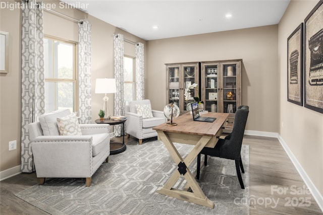 office space featuring baseboards, recessed lighting, and wood finished floors