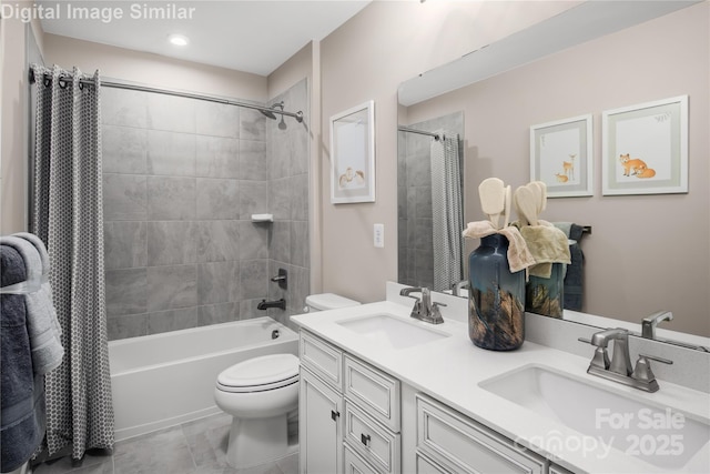 full bath with double vanity, a sink, shower / bath combo, and toilet