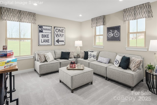 living area featuring carpet floors, baseboards, and recessed lighting