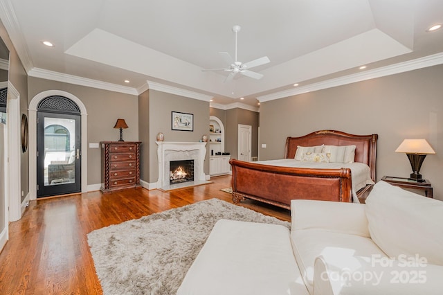 5400 Challisford Ln, Charlotte, NC 28226 - bedroom with a premium fireplace, a raised ceiling, baseboards, and wood finished floors