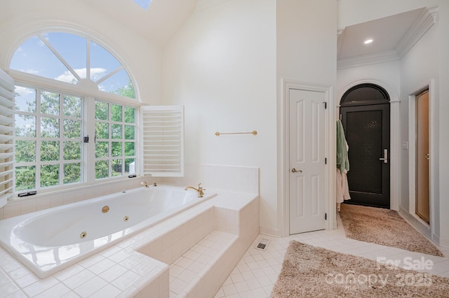 5400 Challisford Ln, Charlotte, NC 28226 - bathroom with ornamental molding, high vaulted ceiling, tile patterned floors, a whirlpool tub, and baseboards