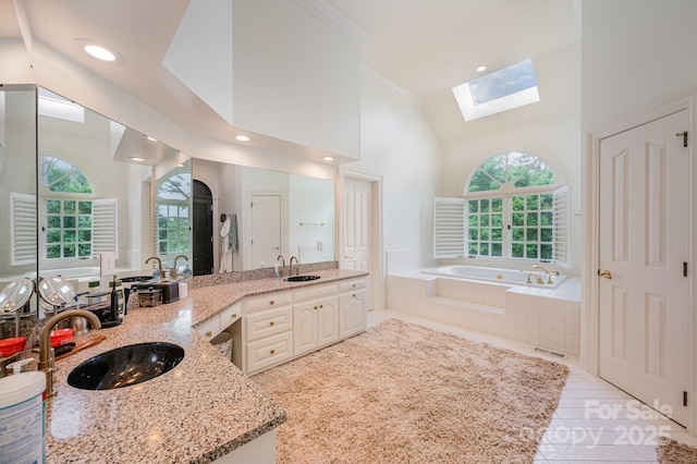 5400 Challisford Ln, Charlotte, NC 28226 - bathroom featuring a skylight, a garden tub, crown molding, tile patterned flooring, and recessed lighting
