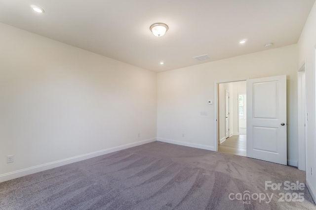 2907 W Trade St, Charlotte, NC 28208 - carpeted empty room featuring baseboards, visible vents, and recessed lighting