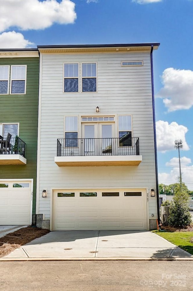 2907 W Trade St, Charlotte, NC 28208 - view of property with concrete driveway and an attached garage