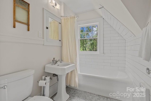 bathroom with toilet, tile patterned flooring, and shower / bathtub combination with curtain