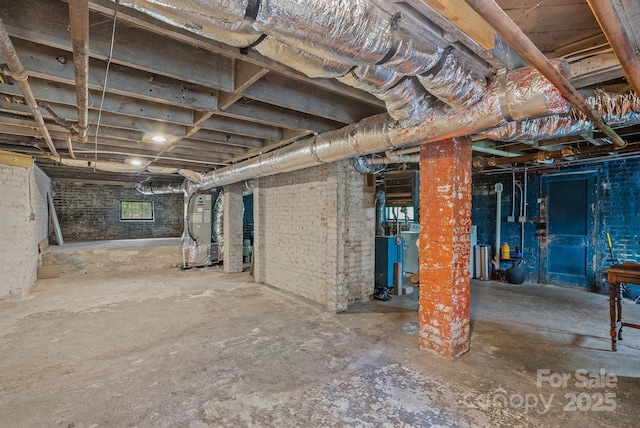 below grade area featuring heating unit
