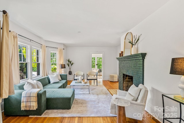 21 Sylvan Ave, Asheville, NC 28801 - living area featuring a fireplace, hardwood / wood-style floors, and baseboards
