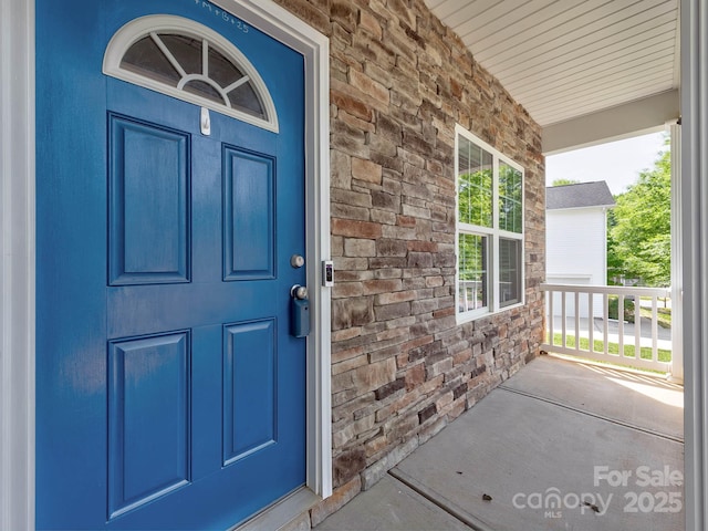 6541 Hasley Woods Dr, Huntersville, NC 28078 - property entrance with covered porch and stone siding