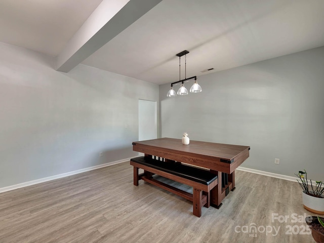 6541 Hasley Woods Dr, Huntersville, NC 28078 - dining area with light wood-style floors, baseboards, beam ceiling, and visible vents