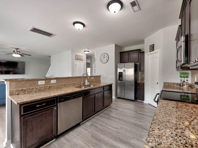 6541 Hasley Woods Dr, Huntersville, NC 28078 - kitchen featuring a ceiling fan, visible vents, dark brown cabinets, a sink, and stainless steel appliances