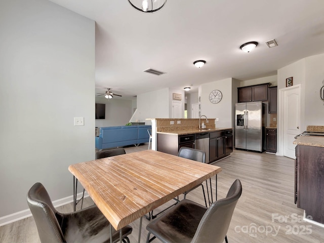 6541 Hasley Woods Dr, Huntersville, NC 28078 - dining space featuring light wood-style floors, baseboards, ceiling fan, and visible vents