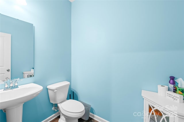 133 W Neel Ranch Rd, Mooresville, NC 28115 - bathroom with toilet, baseboards, a sink, and wood finished floors