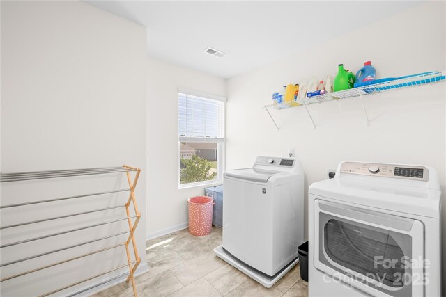 133 W Neel Ranch Rd, Mooresville, NC 28115 - clothes washing area with laundry area, visible vents, light tile patterned flooring, baseboards, and washing machine and clothes dryer