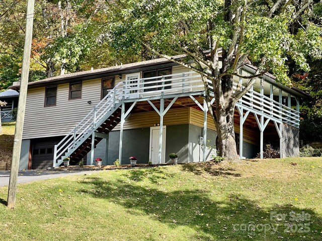 128 Sandsridge Way, Waynesville, NC 28785 - view of front of house with a garage, a front lawn, a wooden deck, driveway, and stairway