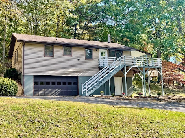 128 Sandsridge Way, Waynesville, NC 28785 - view of front of house with stairs, an attached garage, a deck, a front yard, and driveway