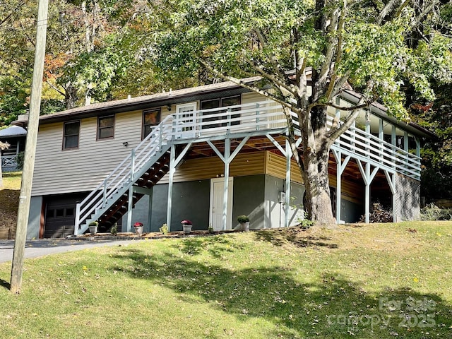 128 Sandsridge Way, Waynesville, NC 28785 - view of front of house with a garage, a front lawn, a wooden deck, driveway, and stairway