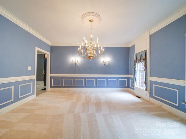 3015 Hamptonbrook Dr, Gastonia, NC 28056 - unfurnished room with a chandelier, ornamental molding, carpet, a decorative wall, and a wainscoted wall