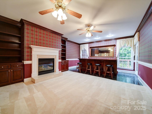 3015 Hamptonbrook Dr, Gastonia, NC 28056 - living room featuring ornamental molding, baseboards, wallpapered walls, a premium fireplace, and ceiling fan