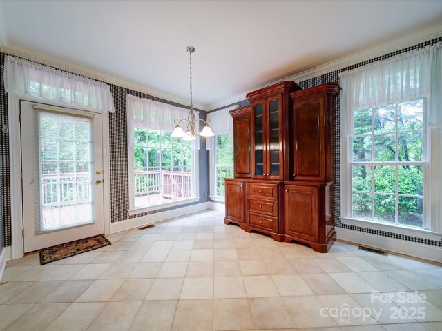 3015 Hamptonbrook Dr, Gastonia, NC 28056 - unfurnished dining area with ornamental molding, a chandelier, and plenty of natural light