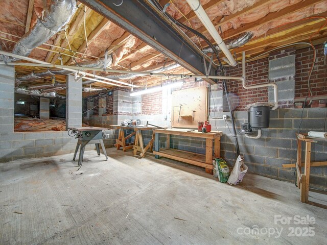 3015 Hamptonbrook Dr, Gastonia, NC 28056 - unfinished below grade area featuring a workshop area and concrete block wall