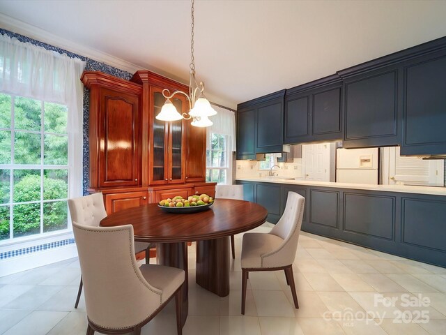 3015 Hamptonbrook Dr, Gastonia, NC 28056 - dining space featuring a chandelier, plenty of natural light, and light tile patterned floors