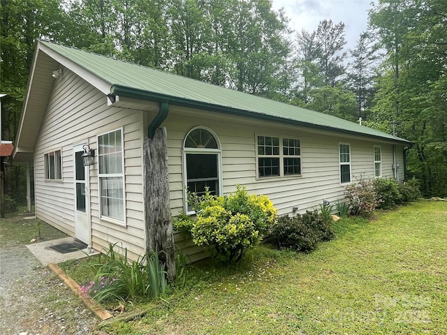 671 High Valley Rd, Bryson City, NC 28713 - view of property exterior featuring a yard and metal roof