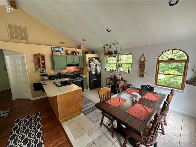 671 High Valley Rd, Bryson City, NC 28713 - dining area with baseboards, visible vents, and lofted ceiling