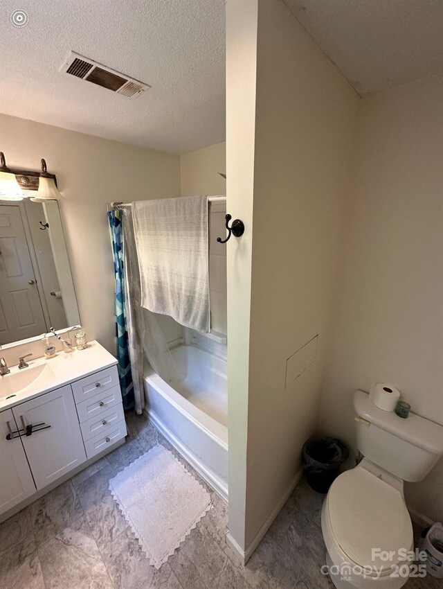 671 High Valley Rd, Bryson City, NC 28713 - full bath with a textured ceiling, visible vents, vanity, toilet, and shower / tub combo with curtain