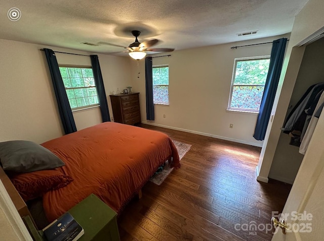 671 High Valley Rd, Bryson City, NC 28713 - bedroom with visible vents, baseboards, ceiling fan, and wood finished floors